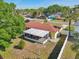 Aerial view shows the home, backyard, and lanai relative to the neighborhood at 8408 Flagstone Dr, Tampa, FL 33615
