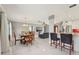 Open concept dining area with new floors adjacent to the living room and kitchen, great for entertaining guests at 8408 Flagstone Dr, Tampa, FL 33615
