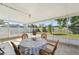 Enclosed lanai featuring tile flooring, a round table and relaxing seating at 8408 Flagstone Dr, Tampa, FL 33615