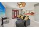 Inviting living room with new marble floors, stylish ceiling fan, and open layout leading into the modern kitchen at 8408 Flagstone Dr, Tampa, FL 33615