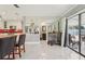 Spacious living space with kitchen views, leading to a cozy outdoor patio at 8408 Flagstone Dr, Tampa, FL 33615