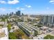 Stunning aerial view of modern townhomes with vibrant city skyline and green spaces nearby at 907 Arlington N Ave, St Petersburg, FL 33705
