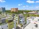 Extensive aerial view of modern townhomes with rooftop decks and stunning city views at 907 Arlington N Ave, St Petersburg, FL 33705