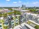 Expansive aerial view of modern townhomes featuring rooftop terraces and downtown views at 907 Arlington N Ave, St Petersburg, FL 33705