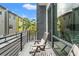 Balcony featuring modern railings and outdoor seating with views of the neighborhood at 907 Arlington N Ave, St Petersburg, FL 33705