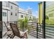Balcony featuring modern railings and outdoor seating with a view of neighborhood buildings at 907 Arlington N Ave, St Petersburg, FL 33705