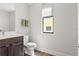 Bathroom with modern vanity, decorative hand towels and a view to the exterior at 907 Arlington N Ave, St Petersburg, FL 33705