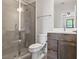 Modern bathroom showcasing a glass enclosed shower, stylish vanity, and contemporary fixtures at 907 Arlington N Ave, St Petersburg, FL 33705