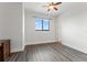 Bright bedroom with natural light, wood-look floors, a ceiling fan, and simple decor at 907 Arlington N Ave, St Petersburg, FL 33705