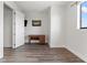 Bright office space with hardwood floors, a classic wooden desk, and a window at 907 Arlington N Ave, St Petersburg, FL 33705