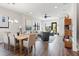 Open-concept living room with hardwood floors, a dining area, and ample seating at 907 Arlington N Ave, St Petersburg, FL 33705