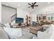 Spacious living room with a modern staircase, open floorplan, and comfortable seating at 907 Arlington N Ave, St Petersburg, FL 33705