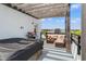 Inviting rooftop deck offers an outdoor living area, pergola, comfortable seating, and city views at 907 Arlington N Ave, St Petersburg, FL 33705