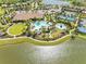 Aerial view of the community center offering a pool, tennis courts, playground, and recreation areas at 10505 Inglenook Ter, Palmetto, FL 34221