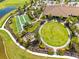 Aerial view of the community center offering lawn bowling, green space, a fire pit, and walking paths at 10505 Inglenook Ter, Palmetto, FL 34221