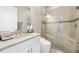 Elegant bathroom with granite countertop vanity and a glass-enclosed shower at 10505 Inglenook Ter, Palmetto, FL 34221