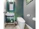 Chic half bath with a modern vanity, stylish mirror and a sleek toilet design at 10505 Inglenook Ter, Palmetto, FL 34221