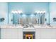 Bathroom with a double vanity, large mirrors, and a tiled walk-in shower at 10505 Inglenook Ter, Palmetto, FL 34221