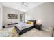 Modern bedroom featuring a sleek platform bed, stylish decor, and neutral color palette at 10505 Inglenook Ter, Palmetto, FL 34221