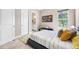 Modern bedroom featuring a sleek platform bed, stylish decor, and neutral color palette at 10505 Inglenook Ter, Palmetto, FL 34221