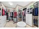 Walk-in closet with custom shelving, drawers, and ample storage space at 10505 Inglenook Ter, Palmetto, FL 34221