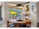 Indoor/outdoor dining area with built-in grill and views of the pool area at 10505 Inglenook Ter, Palmetto, FL 34221
