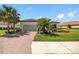 Attractive home with brick driveway, well-kept lawn, and lush landscaping at 10505 Inglenook Ter, Palmetto, FL 34221