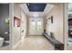 Welcoming foyer featuring tile flooring, decorative lighting, and a dark blue ceiling accent at 10505 Inglenook Ter, Palmetto, FL 34221