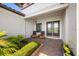 Inviting front porch with seating and neatly landscaped entryway at 10505 Inglenook Ter, Palmetto, FL 34221