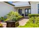 Charming front porch with manicured landscaping and stylish entrance at 10505 Inglenook Ter, Palmetto, FL 34221