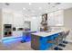Contemporary kitchen boasting stainless steel appliances, stylish lighting, and an island with bar seating at 10505 Inglenook Ter, Palmetto, FL 34221