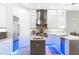 Modern kitchen featuring white cabinetry, stainless steel appliances, and a center island with sink at 10505 Inglenook Ter, Palmetto, FL 34221