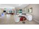 Spacious living room with modern furniture and access to outdoor pool area at 10505 Inglenook Ter, Palmetto, FL 34221
