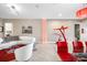 Stylish living room featuring modern furniture, artistic decor, and tiled flooring at 10505 Inglenook Ter, Palmetto, FL 34221