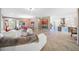 Bright, open concept living room connected to kitchen and dining area, with tile floors at 10505 Inglenook Ter, Palmetto, FL 34221