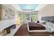 Bright and spacious main bedroom with large windows and stylish decor at 10505 Inglenook Ter, Palmetto, FL 34221