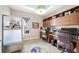 Home office featuring built-in shelving, a large desk, and a window view at 10505 Inglenook Ter, Palmetto, FL 34221