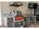 Outdoor kitchen with high-end stainless steel appliances and granite countertops at 10505 Inglenook Ter, Palmetto, FL 34221