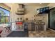 Outdoor kitchen with stainless steel appliances, grill, and beverage center at 10505 Inglenook Ter, Palmetto, FL 34221