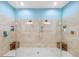 Luxurious shower with dual shower heads, built-in niches, and stylish tile work at 10505 Inglenook Ter, Palmetto, FL 34221