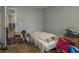 This bedroom features blue walls and brown wood-look floors at 106 Windward Pl, Oldsmar, FL 34677