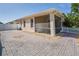The backyard features a screened-in patio and a white picket fence for a relaxing outdoor space at 1129 Haley Ln, Dunedin, FL 34698
