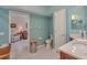 Stylish bathroom featuring blue walls, a vanity with marble countertop, and a shower with a glass door at 1129 Haley Ln, Dunedin, FL 34698