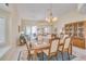 Dining room featuring plenty of natural light, neutral walls, and open concept living space at 1129 Haley Ln, Dunedin, FL 34698