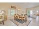 Dining room featuring a bay window, neutral walls, natural light, and a light fixture hanging overhead at 1129 Haley Ln, Dunedin, FL 34698
