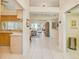 Open-concept interior featuring tile floors, a dining area, and a living room at 1129 Haley Ln, Dunedin, FL 34698