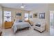 Serene main bedroom with neutral colors, tile flooring, and natural light at 1129 Haley Ln, Dunedin, FL 34698