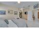 Bright main bedroom leading to ensuite and showcasing a walk-in closet at 1129 Haley Ln, Dunedin, FL 34698