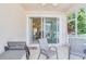 Inviting screened patio provides seamless indoor/outdoor living with access to the interior at 1129 Haley Ln, Dunedin, FL 34698