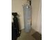 Efficient water heater and filtration system neatly installed in a dedicated utility space at 1129 Haley Ln, Dunedin, FL 34698